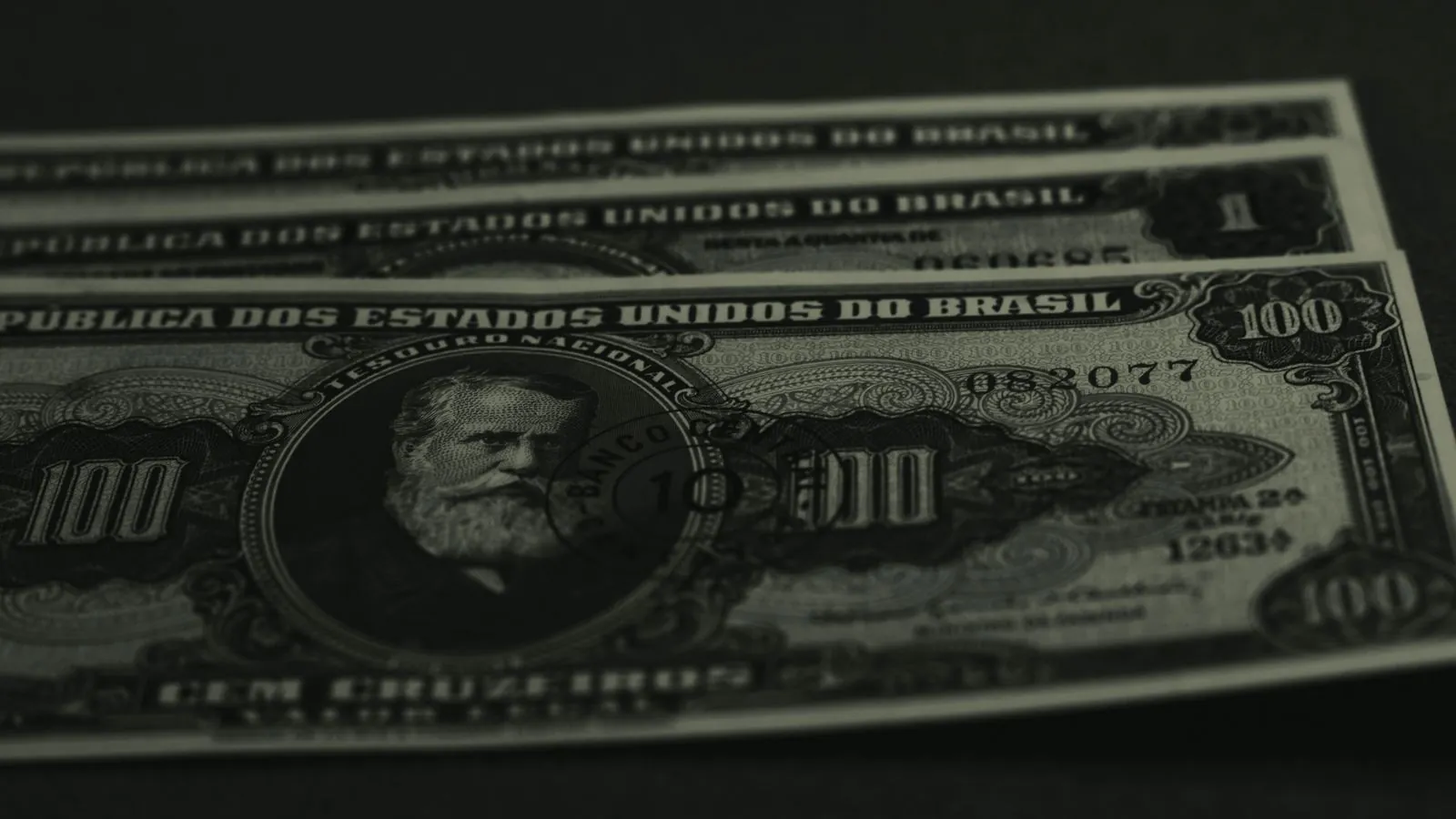 Close-up photo of vintage Brazilian banknotes showcasing historical currency design.