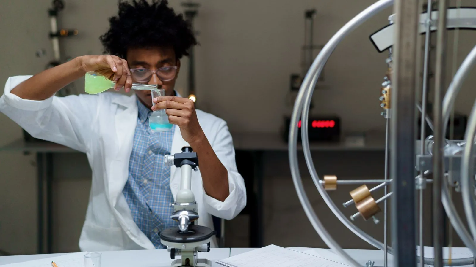 A scientist experiments with chemicals in a laboratory, making scientific discoveries.