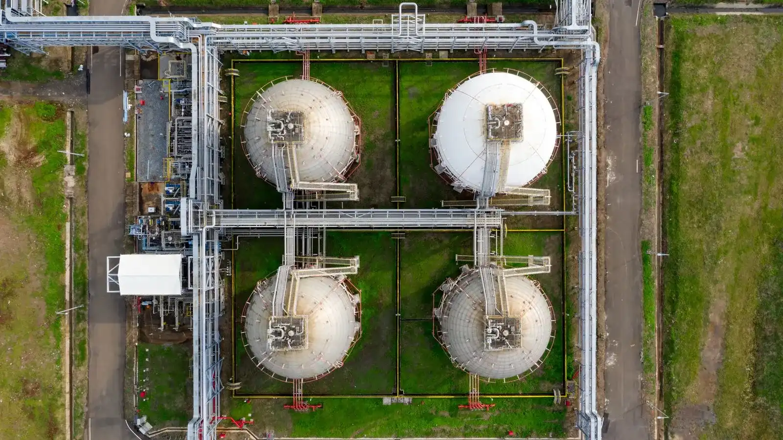 Aerial view of large industrial storage tanks in Banten, Indonesia, showcasing infrastructure and industry.